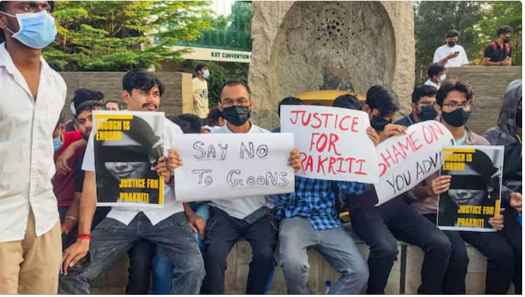 Students hold placards during a protest over the death of a Nepali student at the Kalinga Institute of Industrial Technology (KIIT), in Bhubaneswar